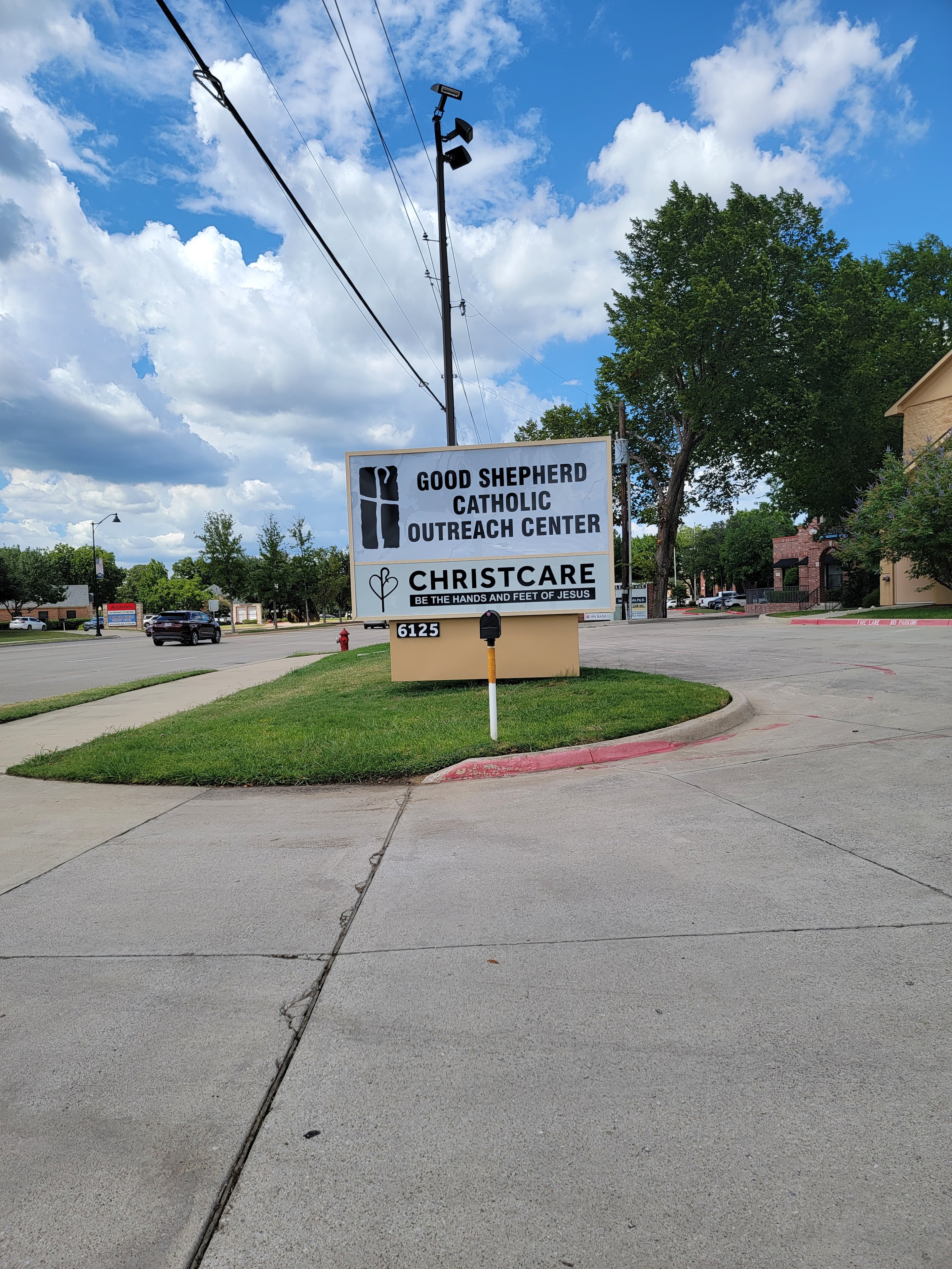 Good Shepherd Catholic Outreach Center sign